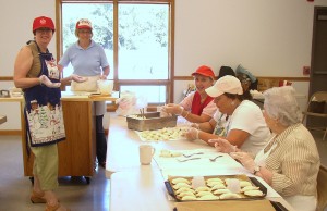 Pat Z, Deb K, Lynne K, and Helen S fill and stuff pierogi.